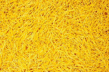 Background from pasta. Horns. Natural product. Close-up. Concept for food advertising