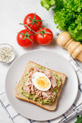 Avocado rye bread toast with tuna and boiled egg