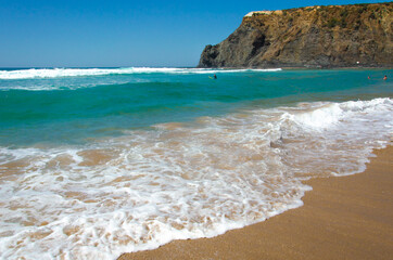 beautiful view of the beach coast of the Atlantic ocean in Portugal. Tourism and recreation. Waves break on the shore, banner.