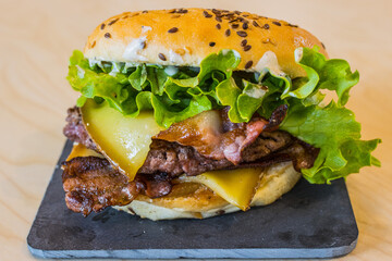 beef burger, cheese, tomatoes, salad