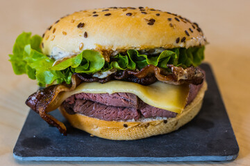 beef burger, cheese, tomatoes, salad