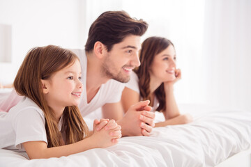 Fototapeta na wymiar Profile photo of young lady guy little girl happy family lying sheets lean hands head toothy smiling good mood spend together quarantine weekend self isolation bedroom indoors
