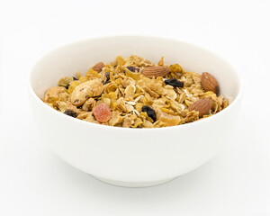Bowl of granola with nuts, oats and raisins on white background