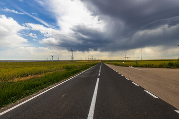 Wind turbines generator for clean energy in the filed on a storm day