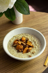 Coconut cream quinoa with caramelised peaches and pecan 