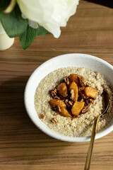 Coconut cream quinoa with caramelised peaches and pecan 