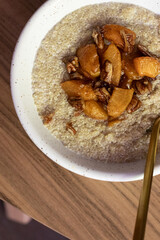 Coconut cream quinoa with caramelised peaches and pecan 