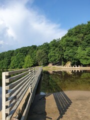 Boat pier in the river harbor overlooking the forest