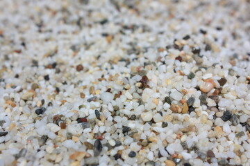 black and white sand on the beach