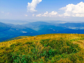Mountain landscape with blue sky and clouds. Feeling freedom, enjoying, and relax. Traveling and vacation concept