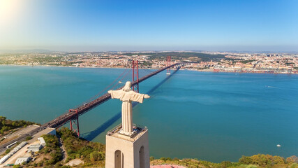 Aerial bridge on April 25th, statue of Jesus Christ Lisbon, Portugal. Historical memo. Close-up.