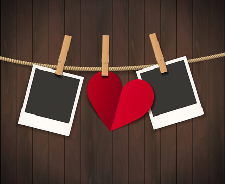 Two photo frames and heart for valentines day hanging on rope on the wood background. Vector illustration. EPS 10.