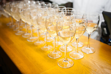 
white wine glasses at the buffet table