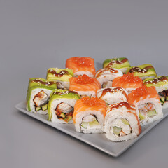 Japanese rolls on grey background.