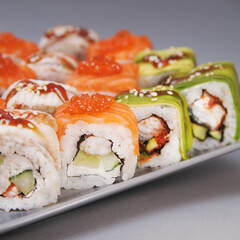 Japanese rolls on grey background.