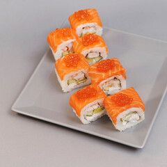Japanese rolls on grey background.