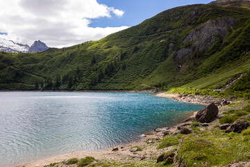 Obraz premium Morasco Lake (VCO), Italy - June 21, 2020: The landscape and Morasco Lake, Morasco Lake, Formazza Valley, Ossola Valley, VCO, Piedmont, Italy