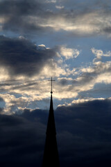 Church spire and clouds in Bonn, Germany