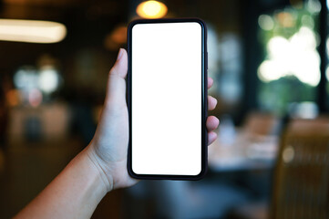 Women's hands holding cell telephone blank copy space screen. smart phone with technology concept