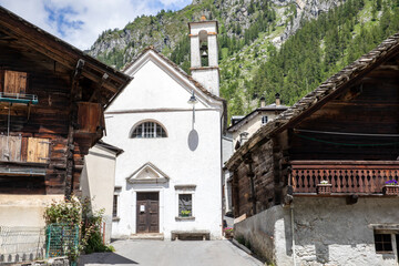 Fototapeta na wymiar Canza (VCO), Italy - June 21, 2020: The church at Canza village, Formazza Valley, Ossola Valley, VCO, Piedmont, Italy