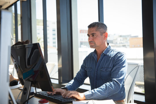 Caucasian business man using a computer 