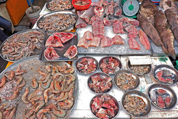 raw cut fillet fish prawn and shrimp at local market