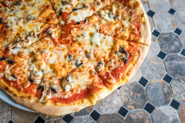 Pizza fungi close up. Pizza in a restaurant. Italian food.