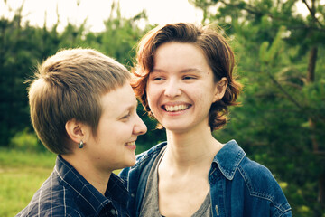 Portrait of happy young lesbian couple enjoying their time together outdoors