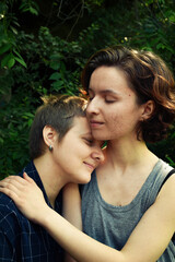 Fototapeta premium Happy young lesbian girls in love; love, affection, same sex relationship and gay family concept