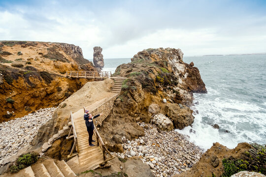 Father and little son admiring nature in Peniche, Portugal
