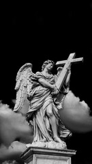 Angel holding the Holy Cross with heavenly clouds. A 17th century baroque masterpiece at the top of Sant'Angelo Bridge in the center of Rome (Black and White with copy space above)