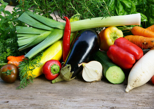 variety of fresh summer vegetables on board, copy space