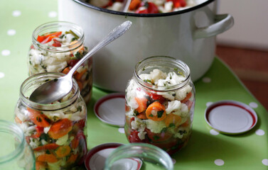 Pickle for winter in jars on the table 