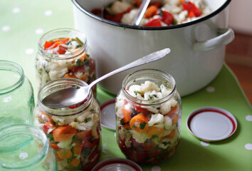 Pickle for winter in jars on the table 
