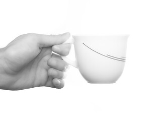 Man hand holding a cup isolated on white background. Simple white and black.