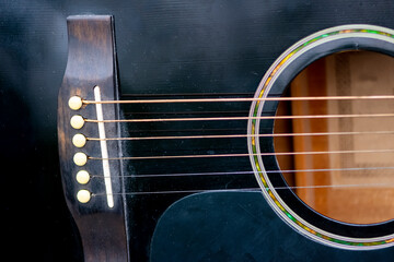 Obraz premium Closeup shot of the acoustic guitar body part