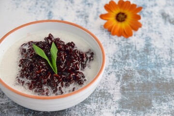 Bubur Ketan Hitam, Indonesian dessert. Black glutinous rice porridge with coconut milk, palm sugar and pandan leaf.