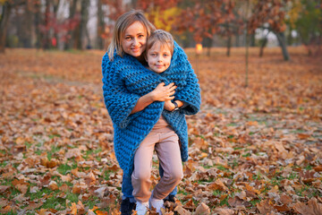 happy family mother and baby son on autumn walk