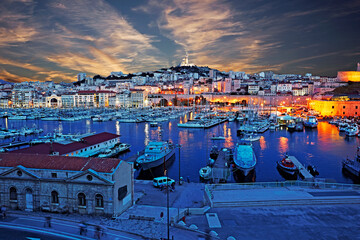 Fototapeta na wymiar Elevated view of the redeveloped port of Marseille illuminated at dusk in France