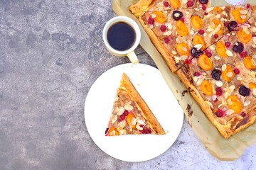 Peach cherry red currant tart puff pastry. Flat lay