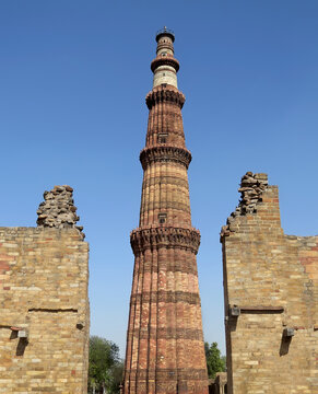 View of the highest in India minaret Kutub Minar - a vivid representative of Mughal architecture of the 13th century. New Delhi.