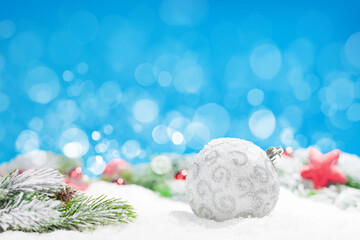 Fototapeta na wymiar Christmas greeting card with decor in snow