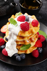 Delicious belgian waffles with summer berries