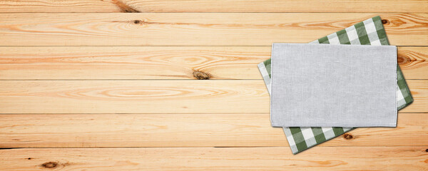 Empty wooden deck table with napkin tablecloth