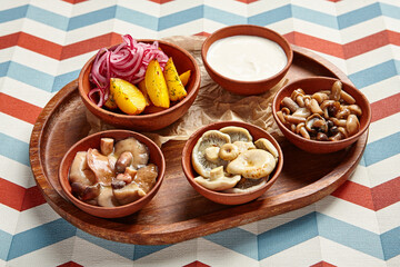 Snack assortment on wooden tray side view