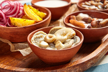 Snack assortment on wooden tray side view