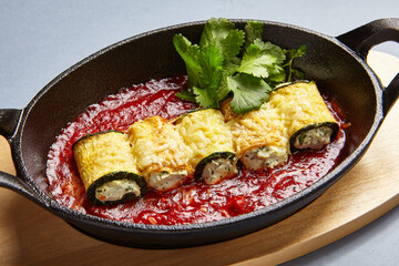 Eggplant rolls with cheese in tomato sauce
