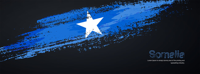 Obraz na płótnie Canvas Grunge brush of Somalia flag on shiny black background. Creative glitter sparkle brush paint vector illustration