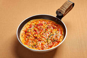 Omelette with tomatoes and seasoning