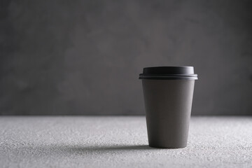 black plastic bottle on wooden background